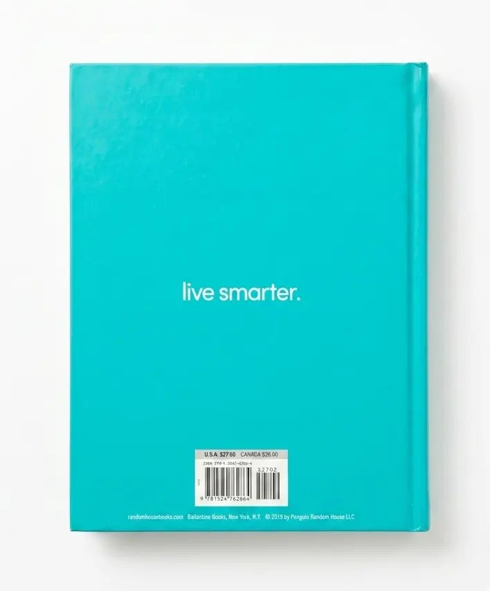 The back cover of a turquoise notebook or journal with the text 'live smarter.' printed in white near the center and a barcode label at the bottom, shown on a plain white background.