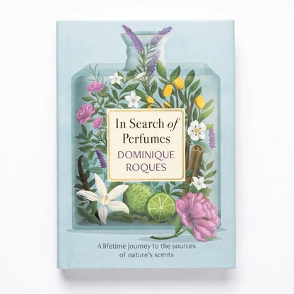 Book cover of 'In Search of Perfumes' by Dominique Roques with floral design on a light blue background