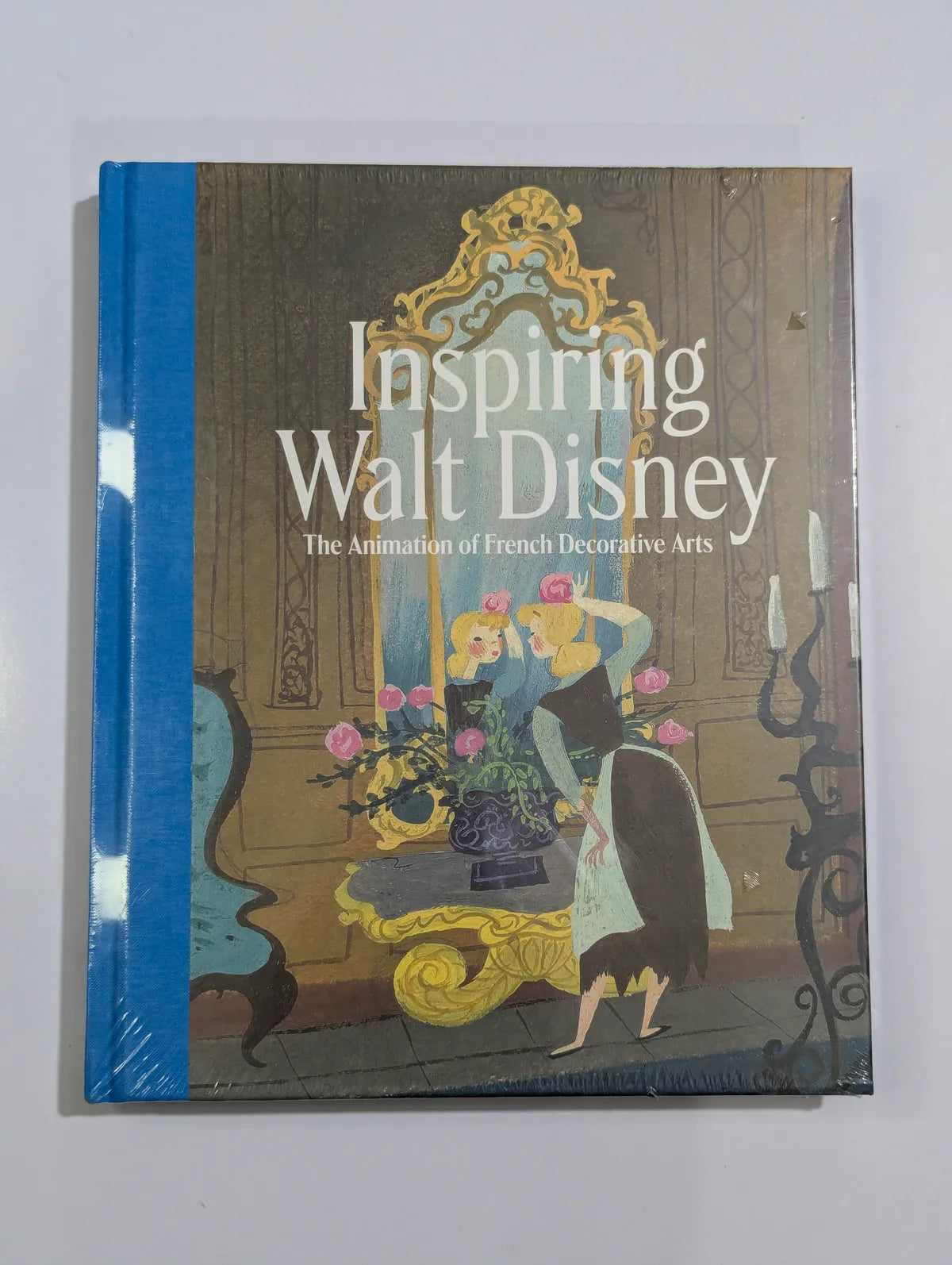 Book cover of 'Inspiring Walt Disney: The Animation of French Decorative Arts' with decorative design and text.