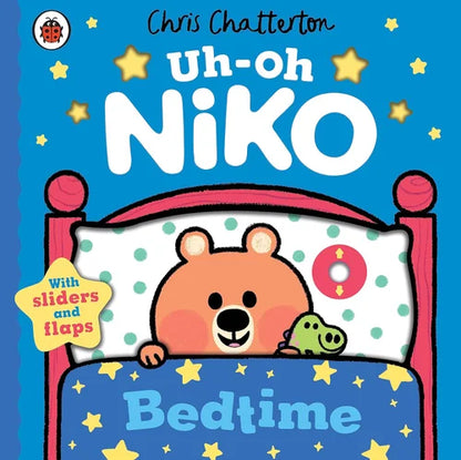 Book cover of 'Uh-Oh Niko Bedtime' with a bear and frog on a bed, featuring sliders and flaps.