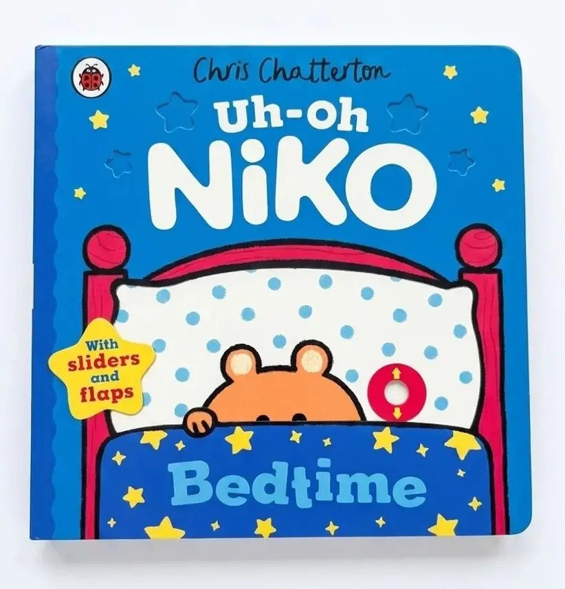 Children's book titled 'Uh-oh Niko Bedtime' with a cartoon character in bed on a blue cover.