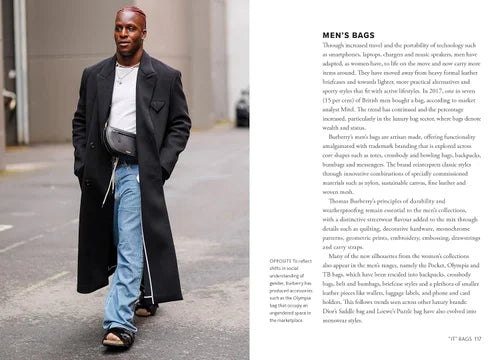 Man walking on a street wearing a long black coat and blue jeans, with text about men's bags on the right.