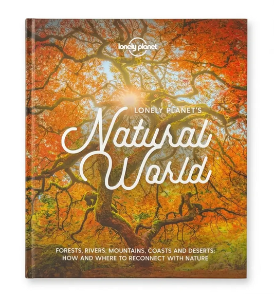 Lonely Planet's Natural World book cover featuring a vibrant autumn forest scene with orange and yellow foliage, white title text, and the Lonely Planet logo at the top.