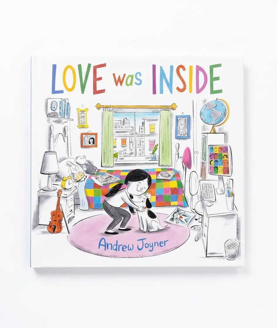 The book cover of 'Love was Inside' by Andrew Joyner, featuring a colorful, whimsical illustration of a bedroom scene with a girl and a cat on a pink rug. The title is written in large, playful multicolored letters at the top.
