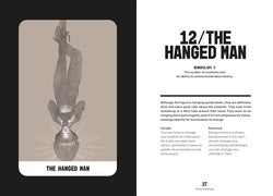 Book page with illustration of 'The Hanged Man' tarot card and text on a white background