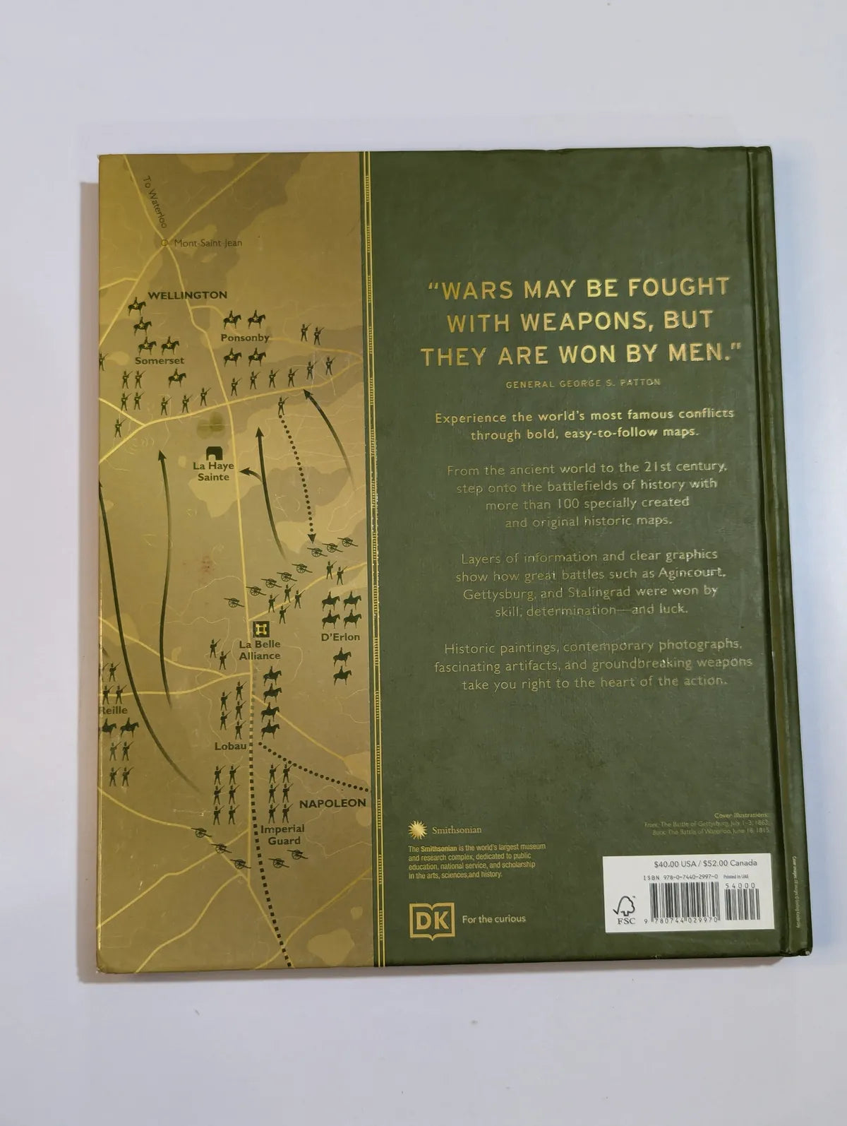 Back cover of a book with military-themed design and text.