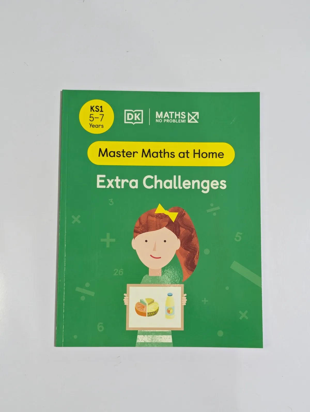 Book titled 'Master Maths at Home Extra Challenges' with a green cover and illustration of a child holding a math problem.