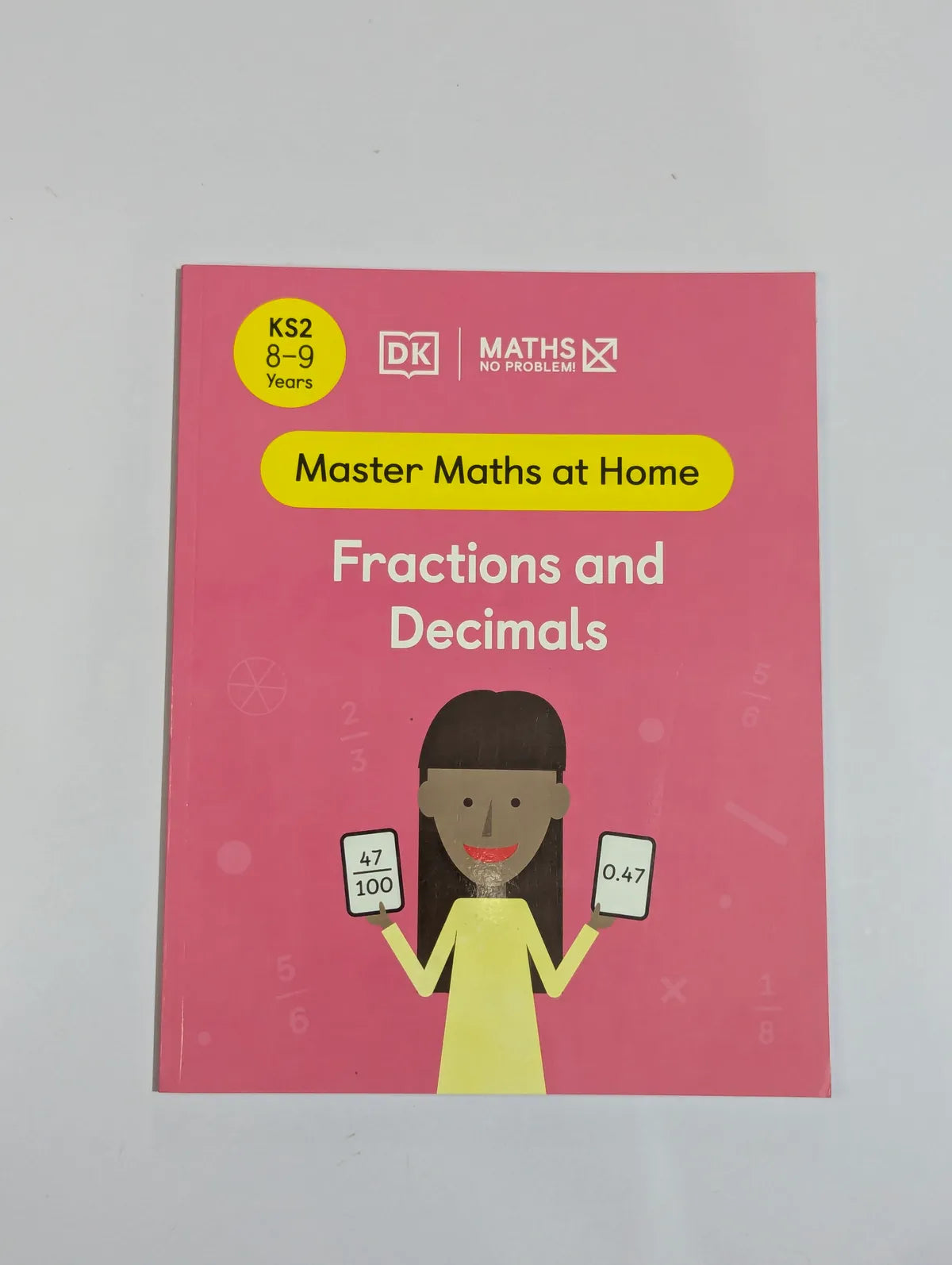 Book titled 'Master Maths at Home: Fractions and Decimals' by DK on a gray background