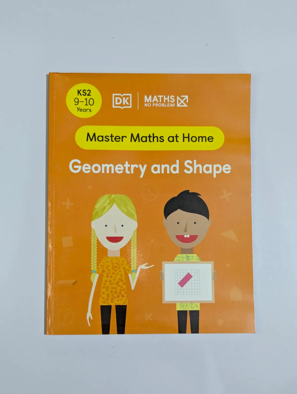 Book titled 'Master Maths at Home: Geometry and Shape' by DK on an orange cover with two illustrated children.