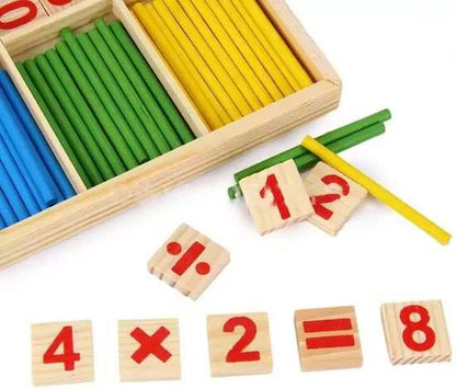 Wooden counting sticks and number blocks on a white background