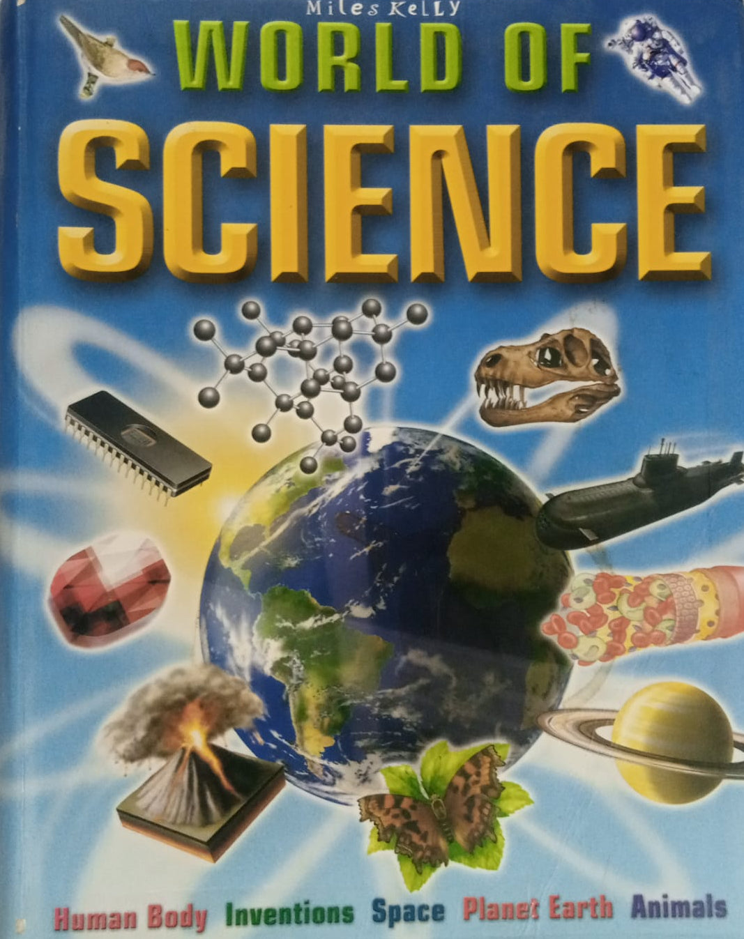 Cover of 'Miles Kelly World of Science' book, featuring a collage of images such as human body, inventions, space, planet Earth, and animals.