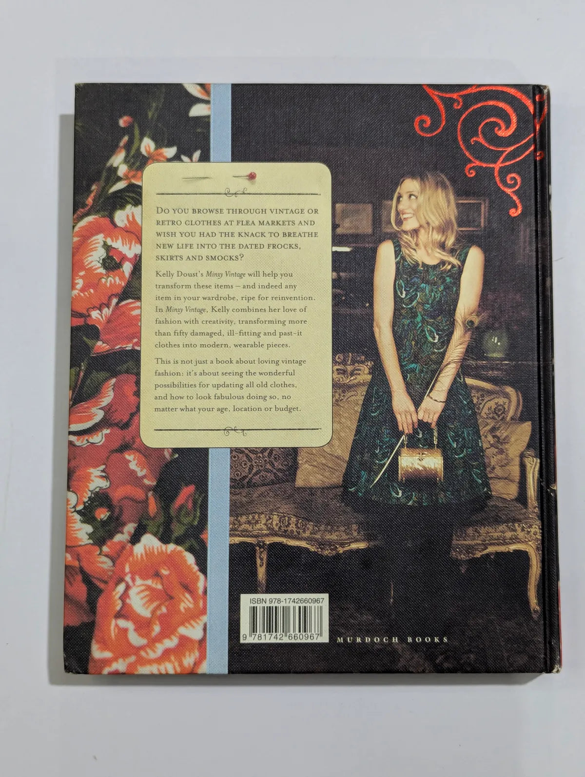 Book cover with a woman in a green dress and floral design on a gray background