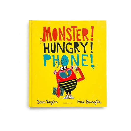 The front cover of the children's book 'Monster! Hungry! Phone!' by Sean Taylor and Fred Bonafia, featuring a bright yellow background with a colorful cartoon monster holding a phone.