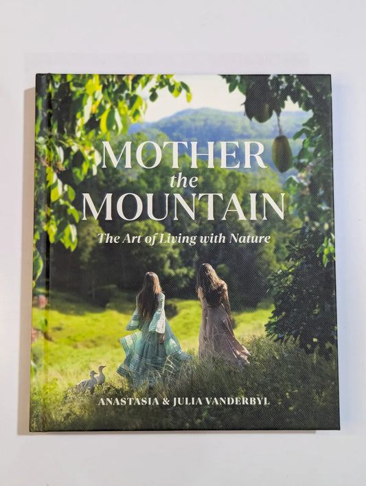 Book titled 'Mother the Mountain' with a scenic cover featuring two women in nature.