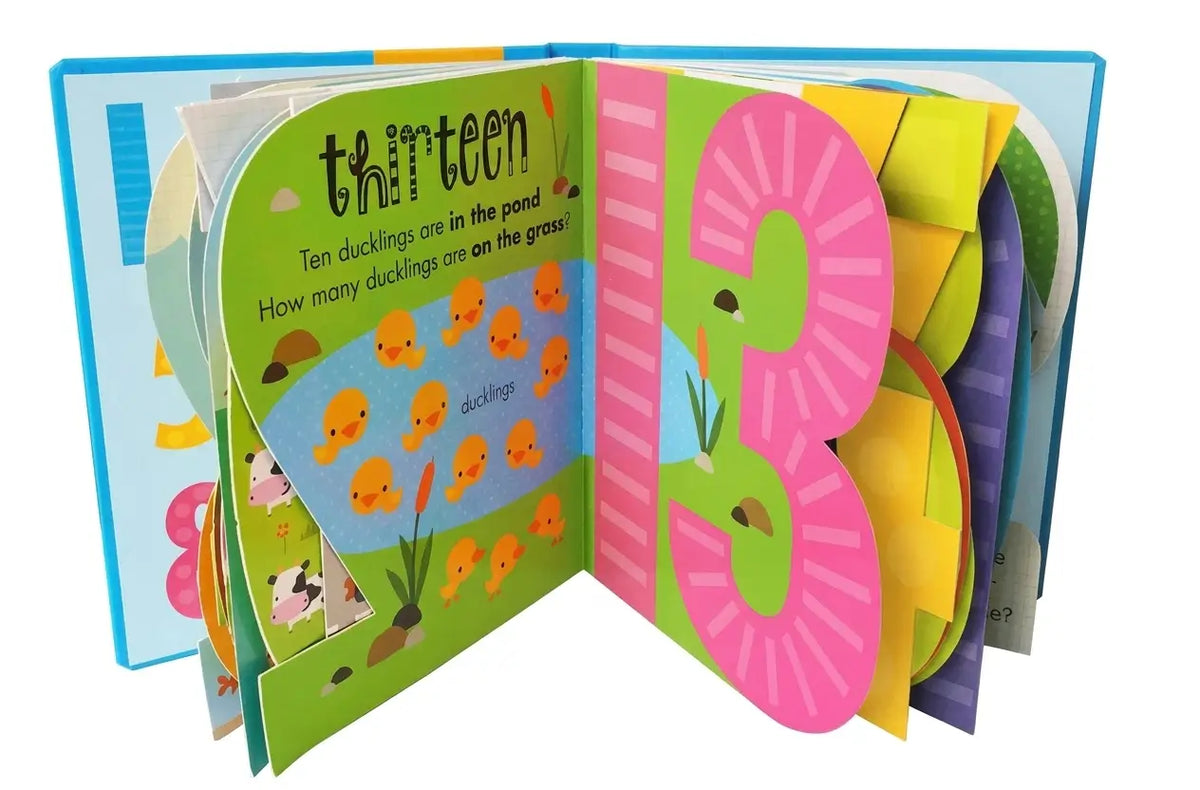 An open children's pop-up book with colorful pages, featuring the number thirteen, ducklings in a pond, and a large pop-up numeral 3.