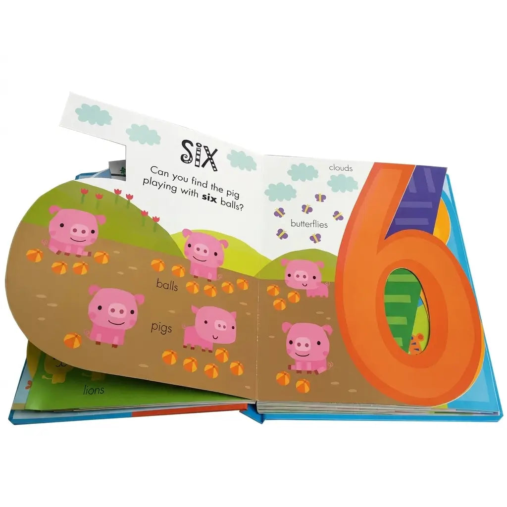 An open children's pop-up number and word book showing a large orange number 6, pink pigs, and labeled illustrations on a white background.