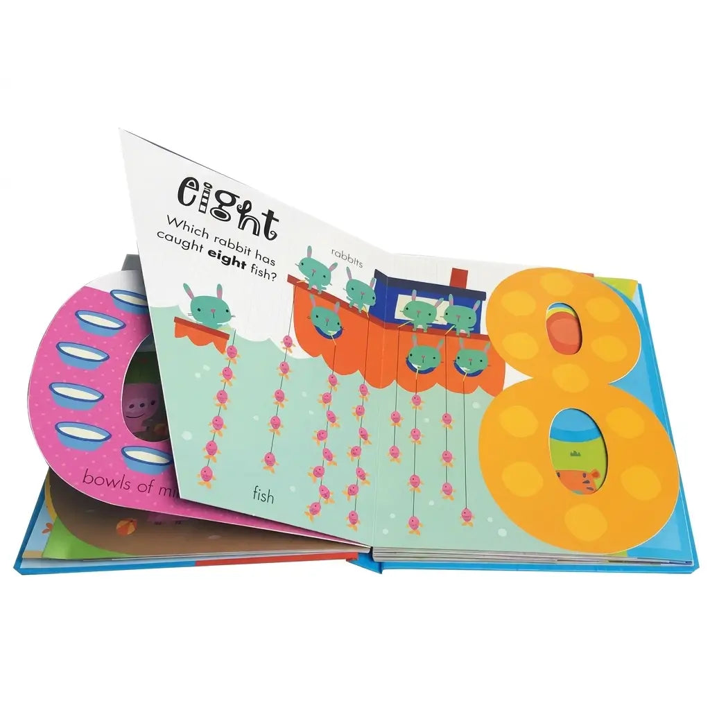 An open children's board book with colorful illustrated pages, including a large yellow number 8, fish, and a pink circular page peeking out from underneath.