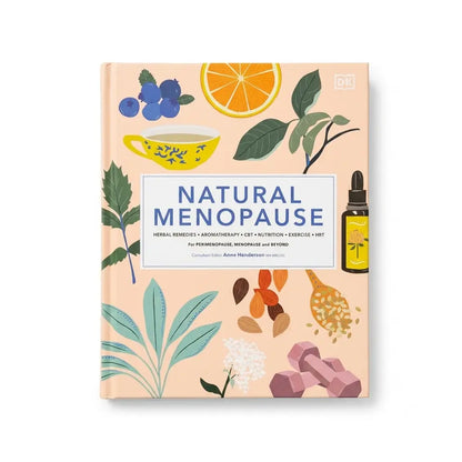Natural Menopause book by DK, featuring a peach-colored cover decorated with botanical illustrations of blueberries, an orange slice, green leaves, a yellow lemon, herbs, seeds, and pink dumbbells. A small dropper bottle illustration is on the right side of the cover.