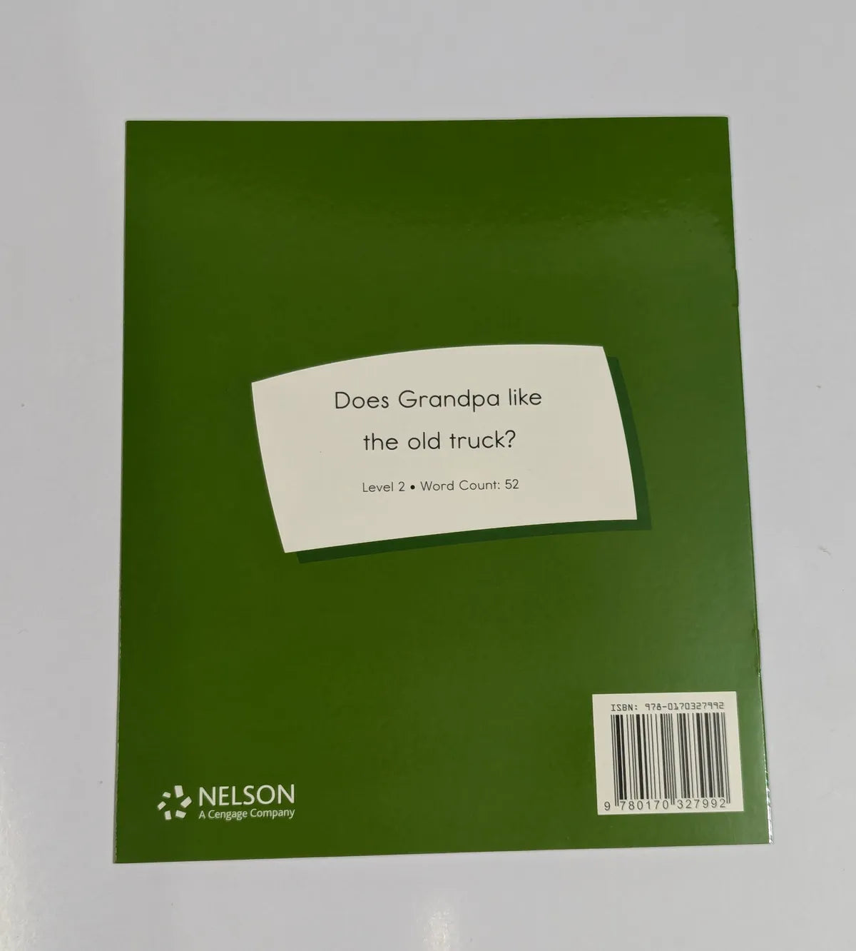 Green book cover with a label and Nelson logo on a white background
