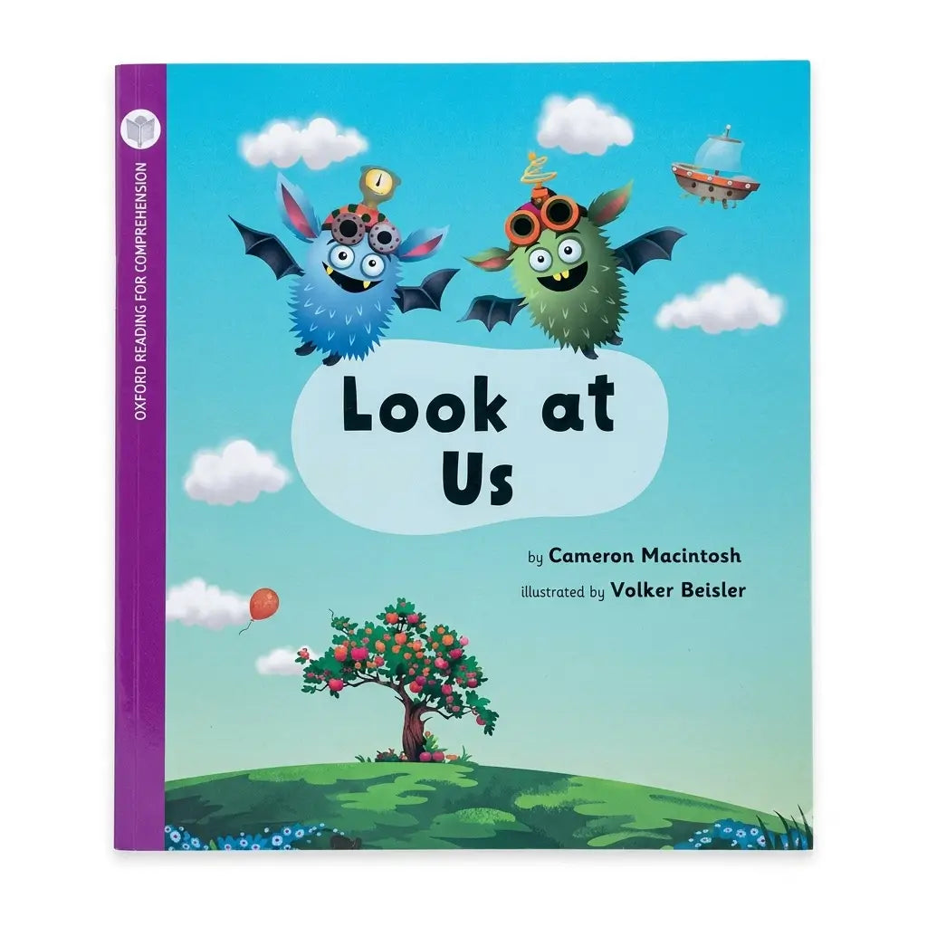 Children's book titled "Look at Us" with a colorful illustrated cover showing two cartoon monsters, clouds, a tree, and a purple spine band. Visible text includes Oxford Reading for Comprehension and creators Cameron Macintosh and Volker Beisler.
