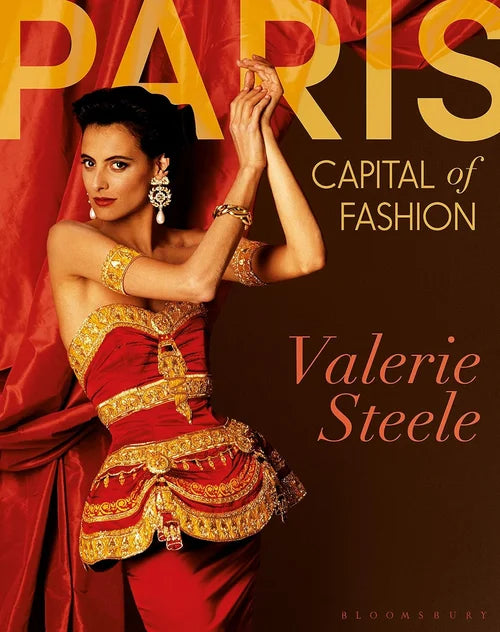 Book cover featuring a woman in a red and gold outfit with 'Paris: Capital of Fashion' text.