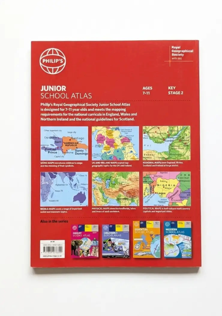Philips Junior School Atlas Key Stage 2, Stage 2 edition, featuring a bright red cover with educational content and multiple inset maps.