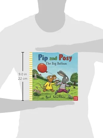 Book titled 'Pip and Posy: The Big Balloon' held by a person to show size.