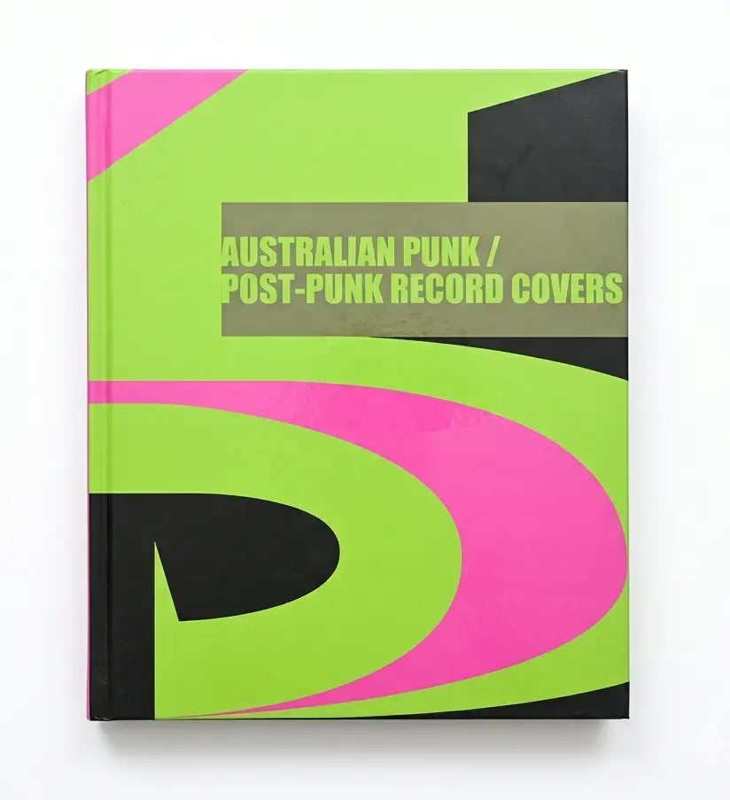 A hardcover book titled 'Australian Punk / Post-Punk Record Covers' featuring a bold abstract cover design in neon lime green, hot pink, black, and a muted taupe-brown block with white text.