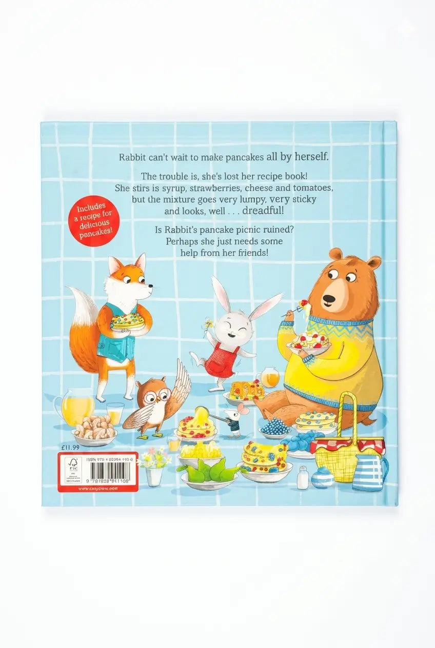 Book back with cartoon animals around a table, featuring a recipe book and a pancake mix container.
