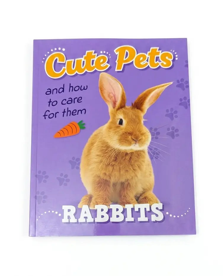 A children's book titled 'Cute Pets and how to care for them RABBITS' on a purple cover, featuring a photo of a brown rabbit and an orange carrot illustration.