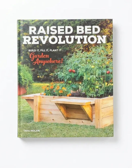 The book 'Raised Bed Revolution' by Tara Nolan is shown standing upright against a clean white background. The cover features a vibrant garden scene with a wooden raised bed containing tomato plants and other vegetables, with bold white and orange text.