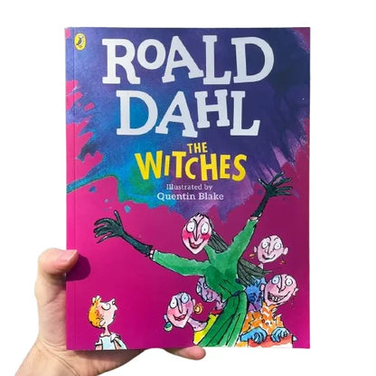 Book titled 'The Witches' by Roald Dahl with colorful cover and hand holding the book.