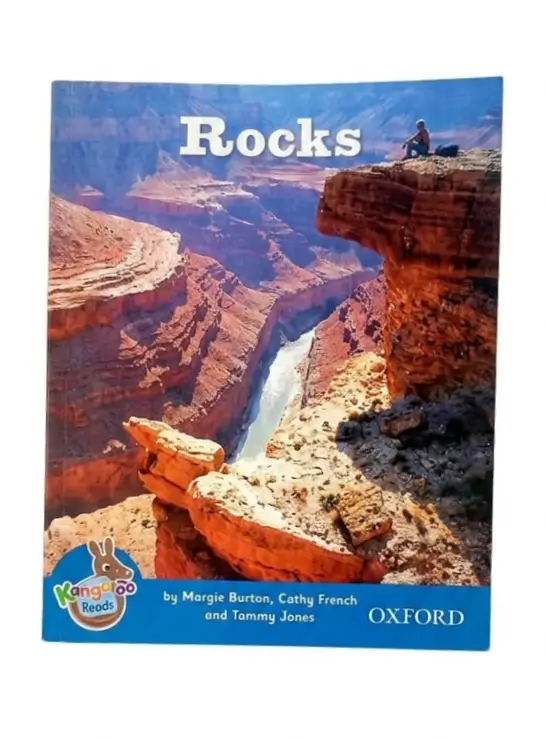 Children's hardcover book titled 'Rocks' from the Oxford Transparens Reads series, featuring a cover illustration of the Grand Canyon with a child sitting on the cliff edge.