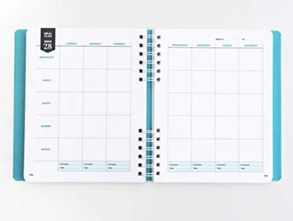 Open planner with weekly layout on a white background