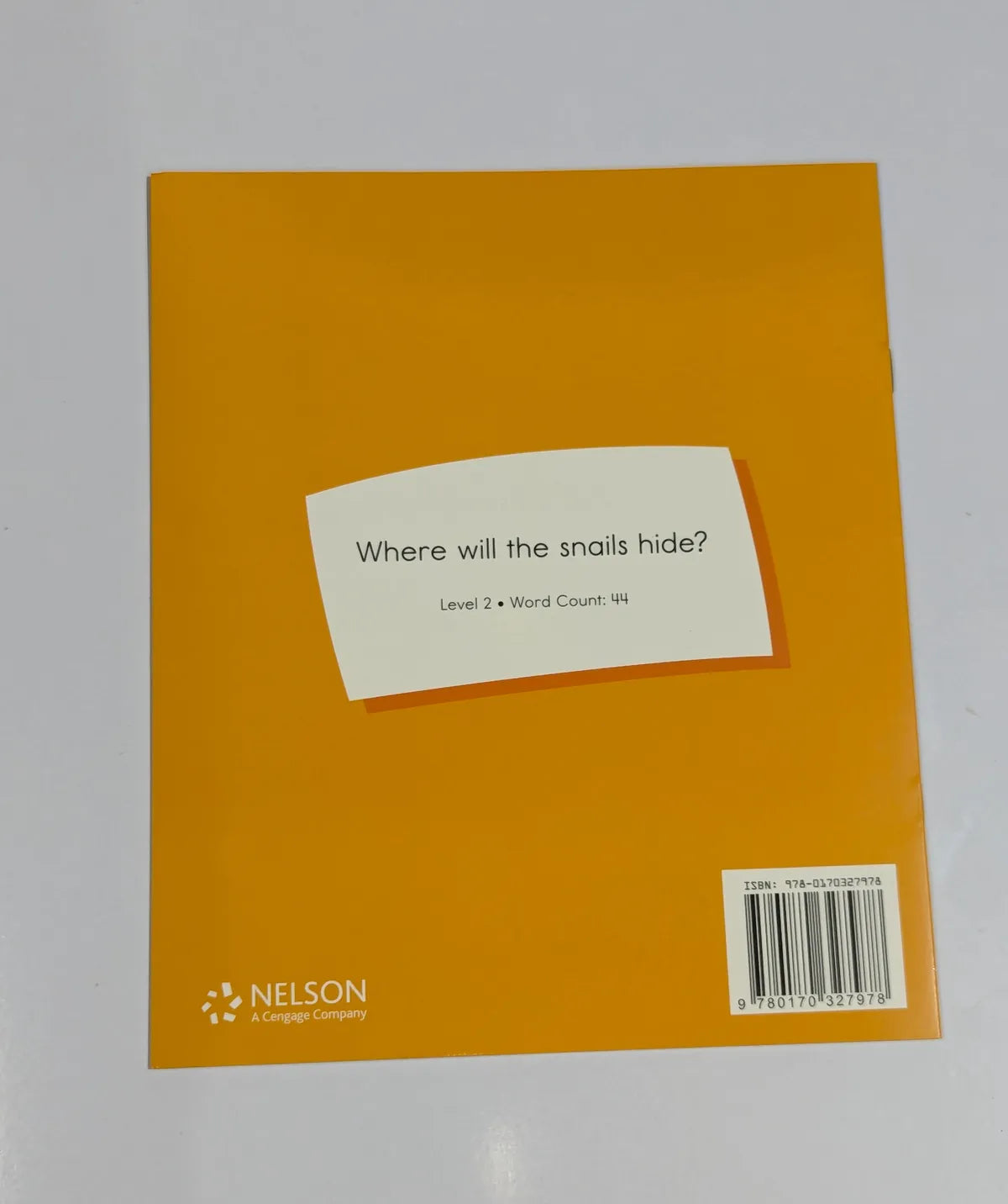Orange book cover with a white label and Nelson logo on a gray background