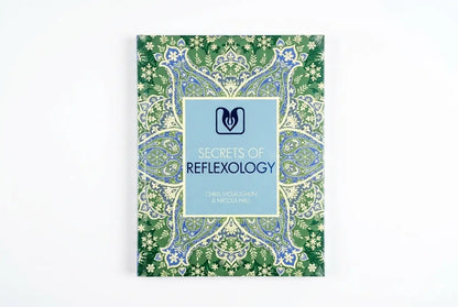 Book titled 'Secrets of Reflexology' with decorative cover on a white background