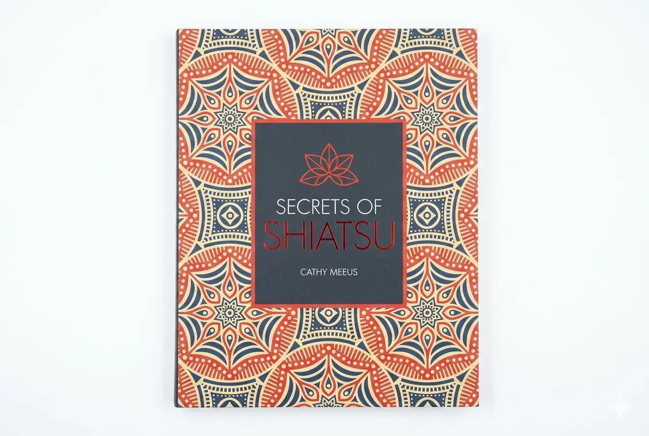 Book titled 'Secrets of Shiatsu' with a decorative cover on a white background