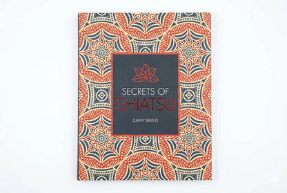 Book titled 'Secrets of Shiatsu' with a decorative cover on a white background