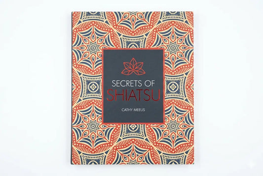 Book titled 'Secrets of Shiatsu' with a decorative cover on a white background