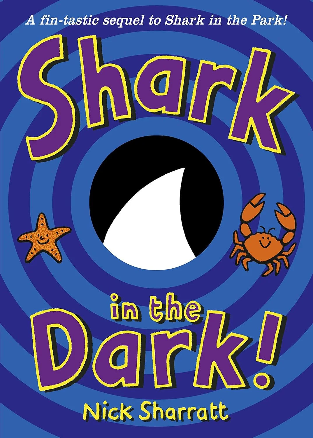 Book cover of 'Shark in the Dark!' with colorful text and illustrations on a blue background.