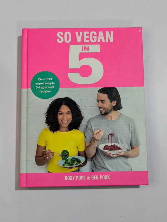 Book titled 'So Vegan in 5' with a pink cover featuring two people holding plates of food.