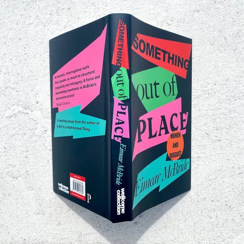Book titled 'Something Out of Place' by Eimear McBride on a textured gray background