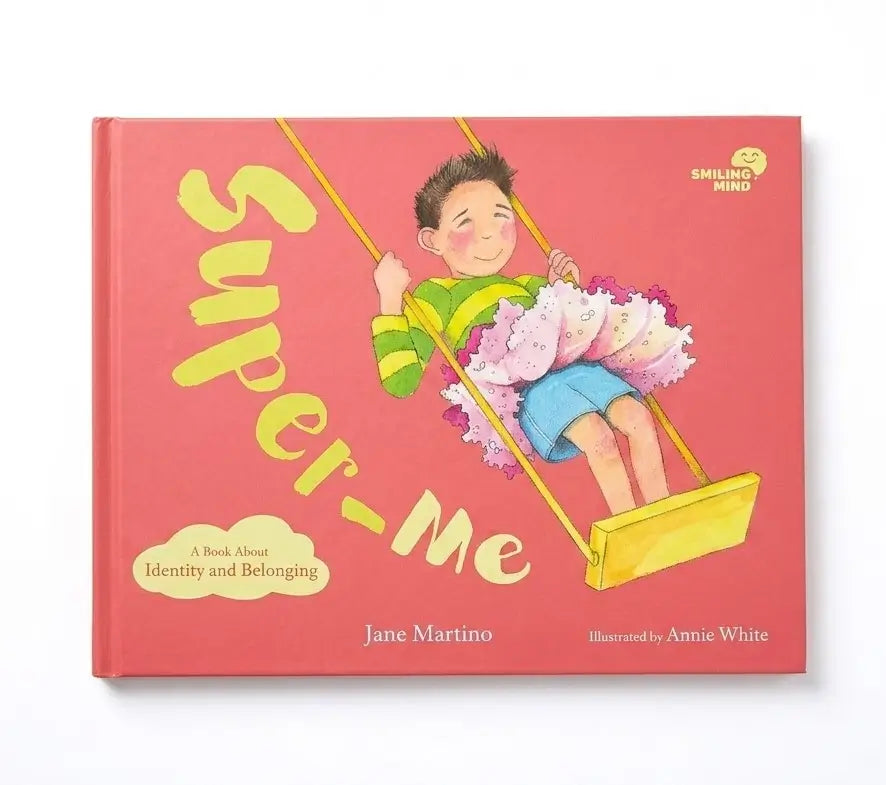 Children's book titled 'Super-Me' by Jane Martino, illustrated by Annie White, published by Smiling Mind. The book features a bright pink cover with a colorful illustration of a child on a swing holding a bouquet of flowers.