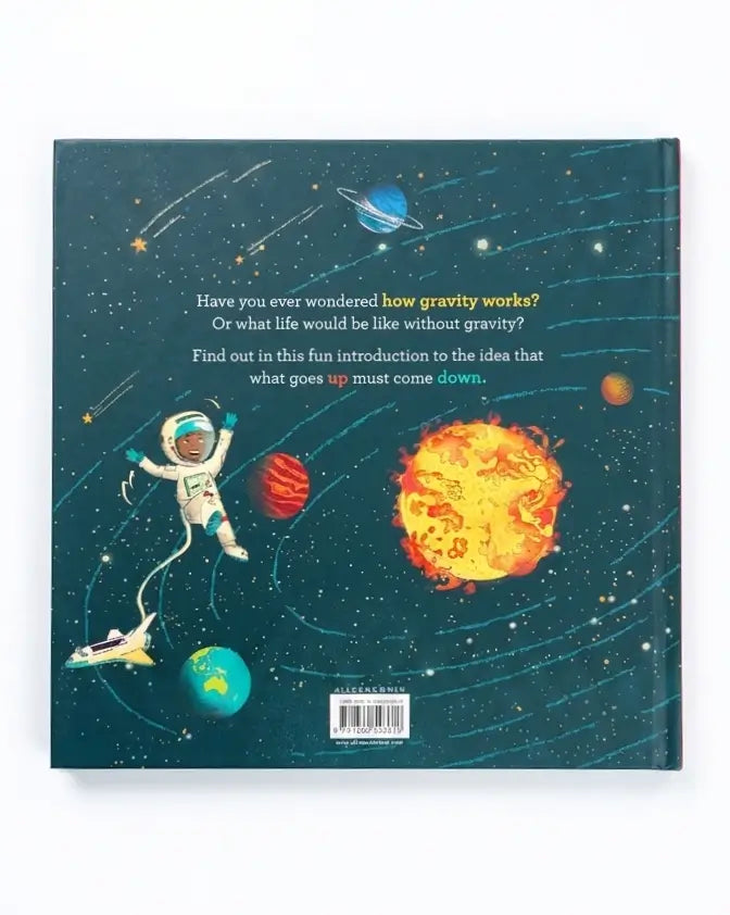The back cover of a hardcover children's book featuring a colorful space illustration with an astronaut, planets, stars, and a large yellow-orange sun. The text on the cover reads, 'Have you ever wondered how gravity works? Or what life would be like without gravity? Find out in this fun introduction to the idea that what goes up must come down.