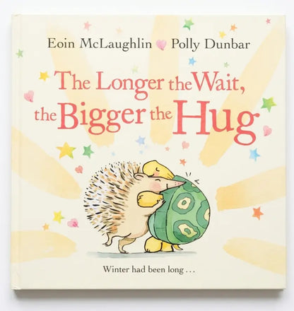Book cover of 'The Longer the Wait, the Bigger the Hug' with hedgehogs and colorful text.