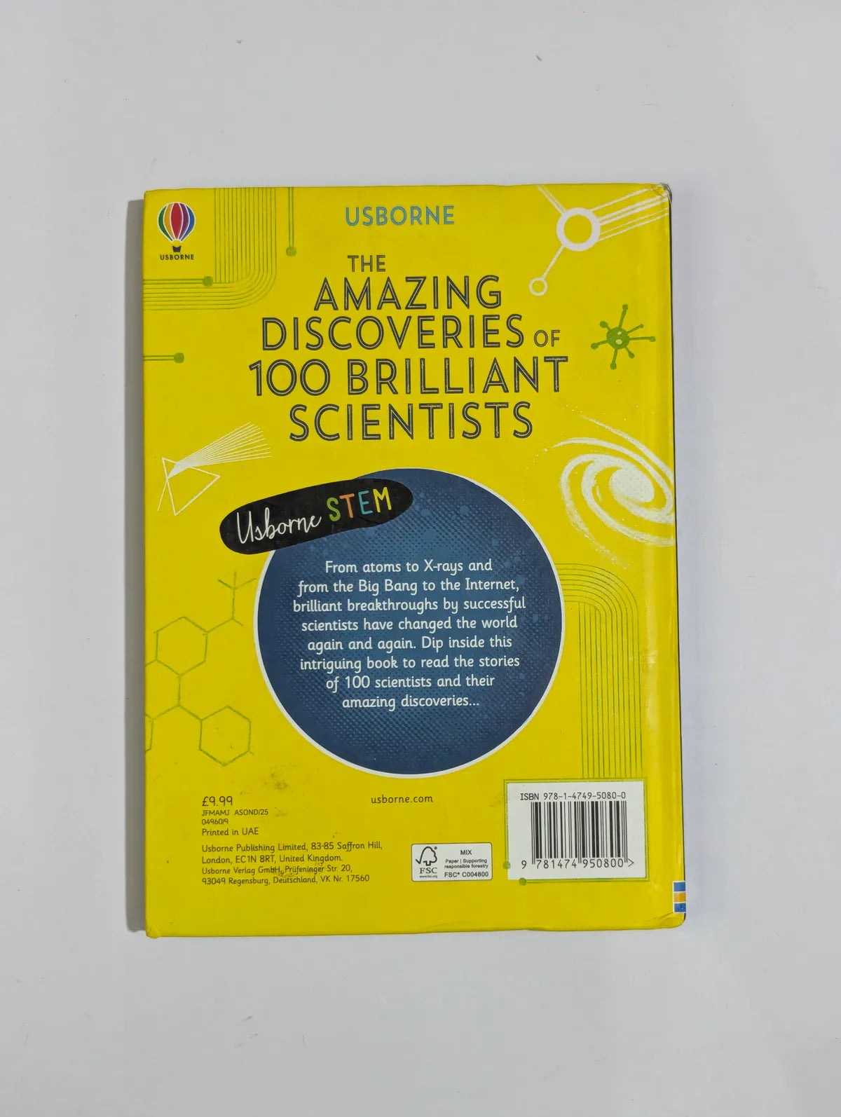 Book titled 'The Amazing Discoveries of 100 Brilliant Scientists' by Usborne on a white background