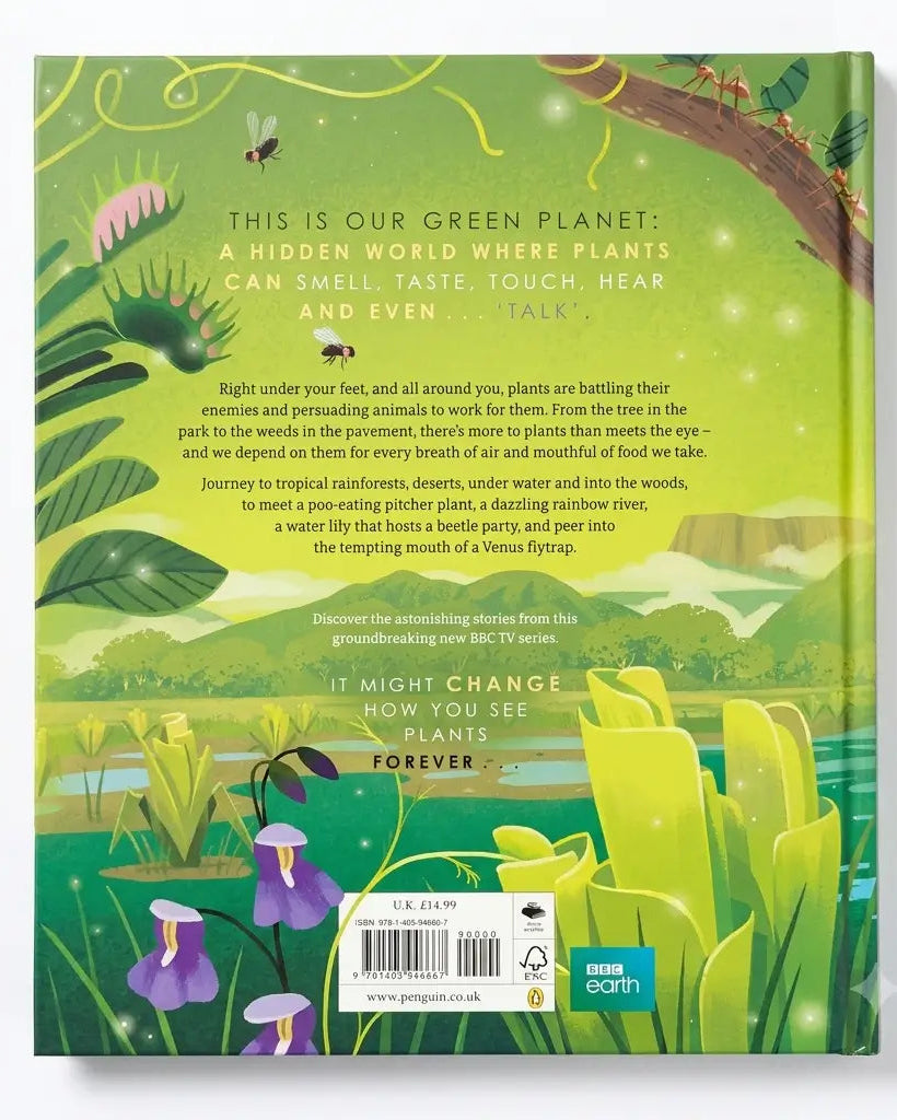 The back cover of the BBC Earth 'This Is Our Green Planets' book, featuring a vibrant green and yellow illustration of a lush forest with purple flowers, a frog, and a butterfly, along with descriptive text and a barcode.