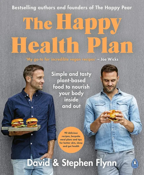 Book cover of 'The Happy Health Plan' featuring two men with food, on a gray background.