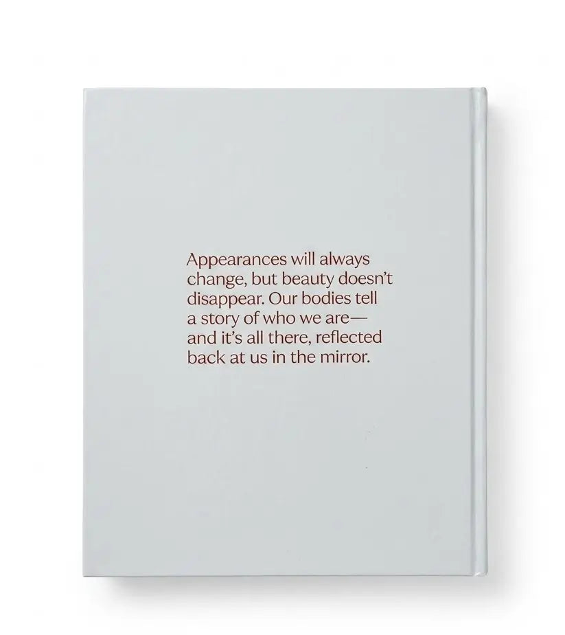 A light gray hardcover journal with centered brown text on the front cover, shown against a plain white background.