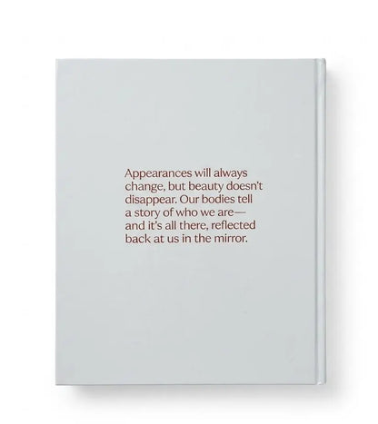 A light gray hardcover journal with centered brown text on the front cover, shown against a plain white background.